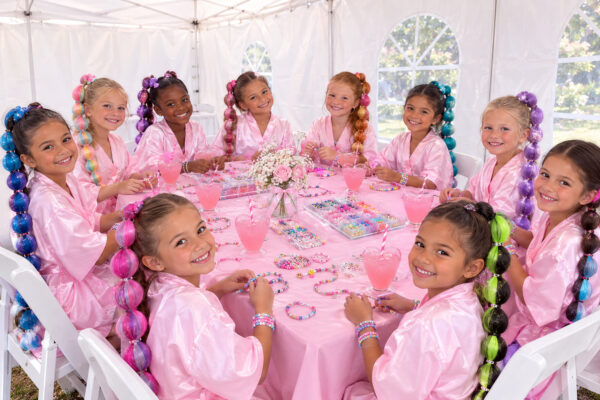 Our parties begin with a pink lemonade toast and include keepsake crafts.